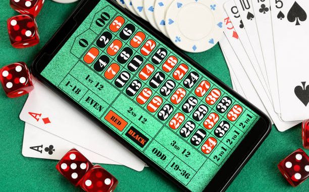 smart phone with roulette table, online gambling concept Why More Players Are Switching to Bitcoin Gambling for Privacy